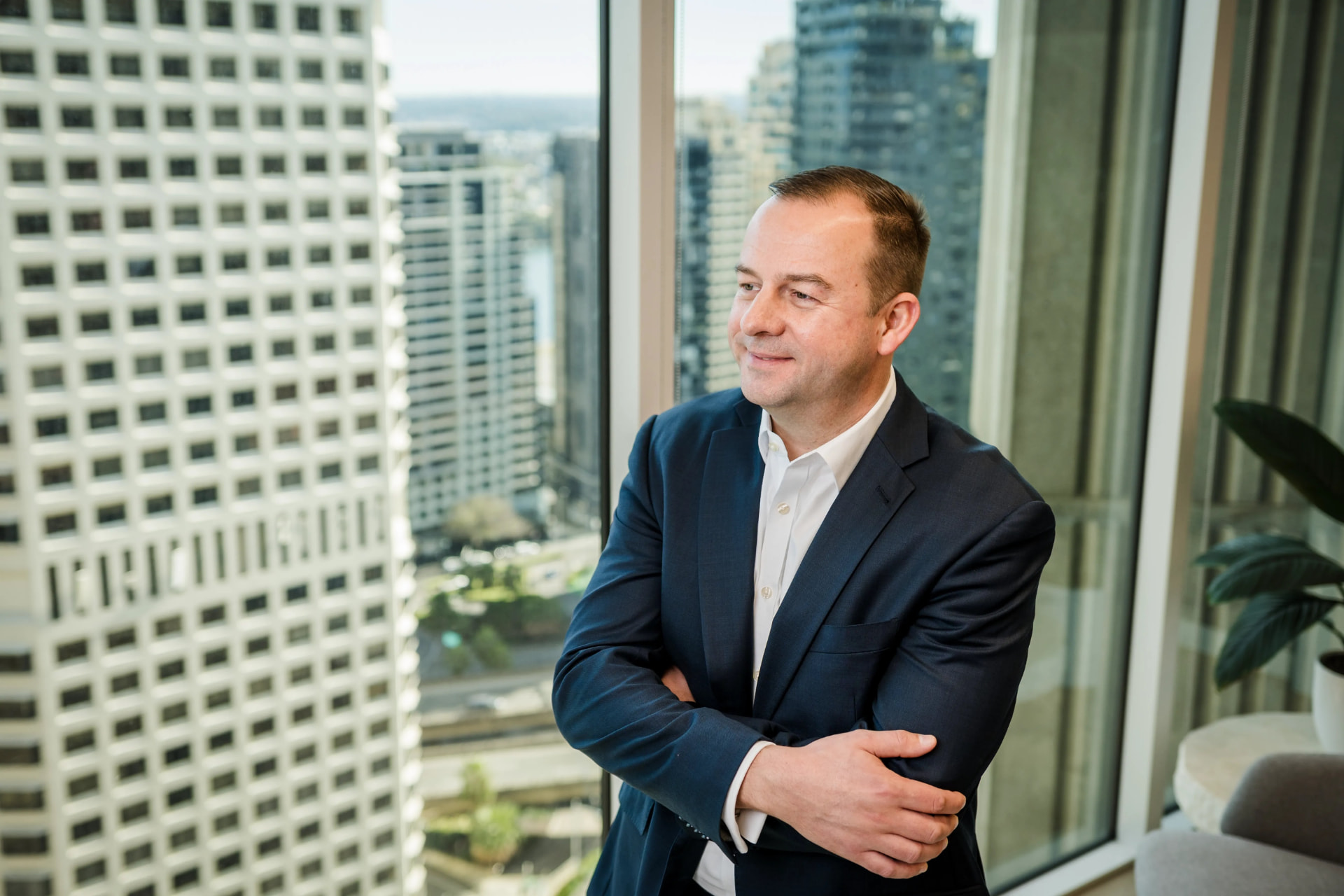 Executive portrait with Sydney skyline behind